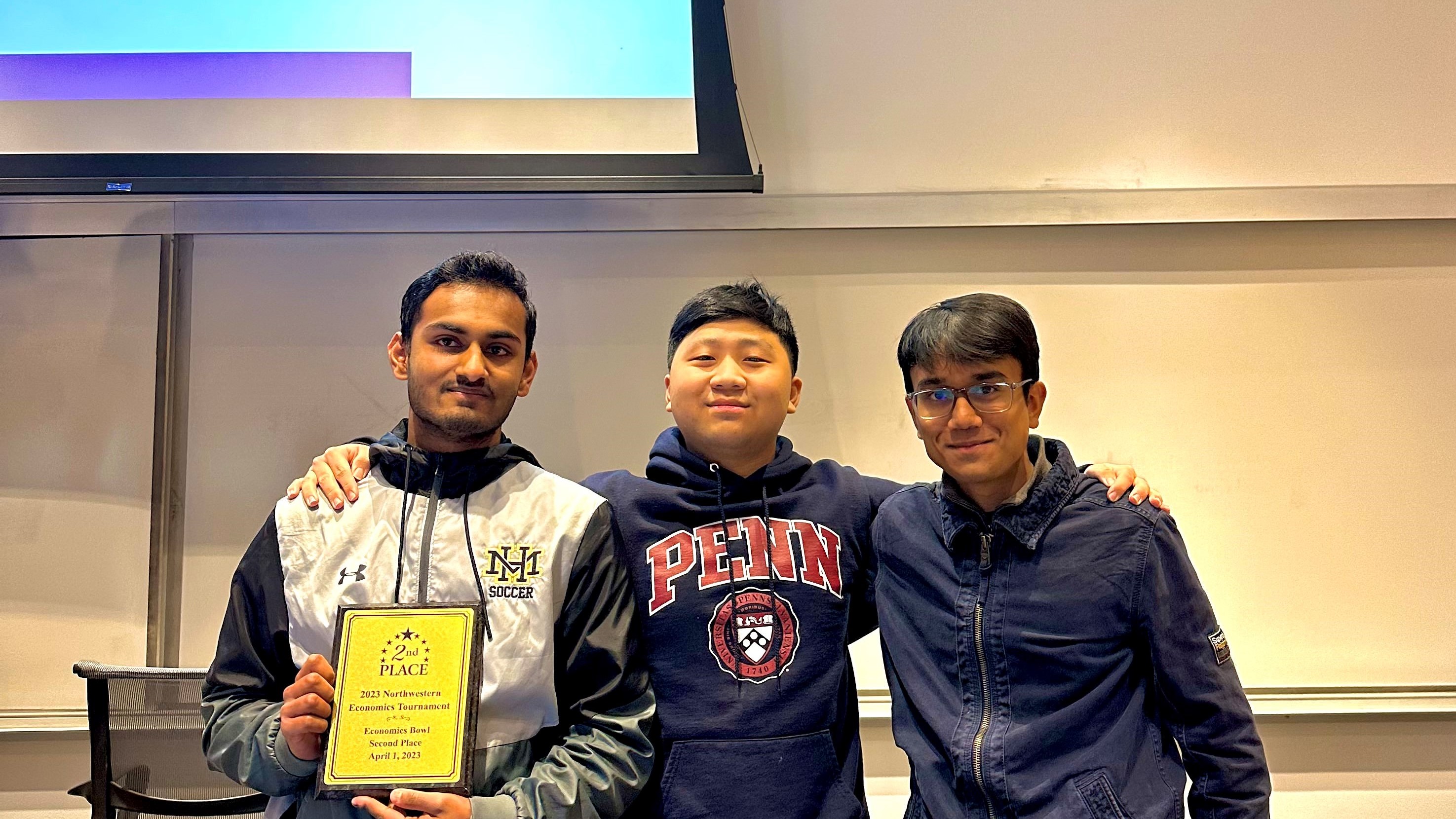 Applications & Research Laboratory team holding their second place plaque.